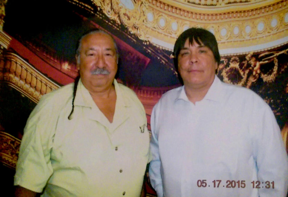 Image: Leonard Peltier and his son, Chauncey, during a visit in prison in 2015. (Courtesy of Chauncey Peltier)