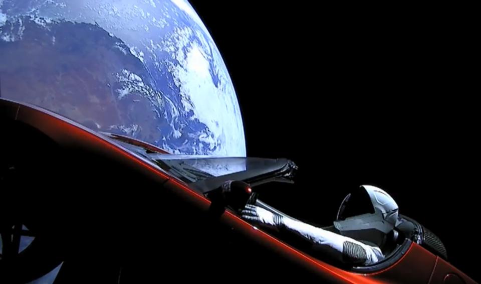 A camera shows SpaceX's Starman mannequin and Elon Musk's Tesla Roadster as they fly above a ROUND Earth after launching on the first Falcon Heavy rocket test flight on Feb. 6, 2018.