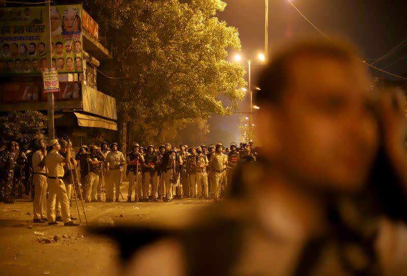 FILE PHOTO: Police personnel stand guard after clashes broke out during a Hindu religious procession in Jahangirpuri area of New Delhi