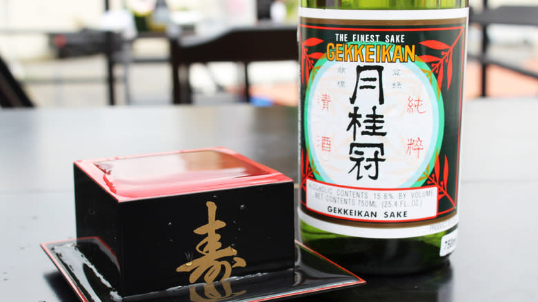 Gekkeikan sake on black table