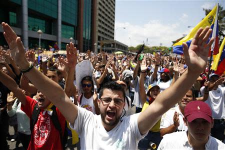 Anti-government protesters march during a demonstration in Caracas March 12, 2014. REUTERS/Carlos Garcia Rawlins