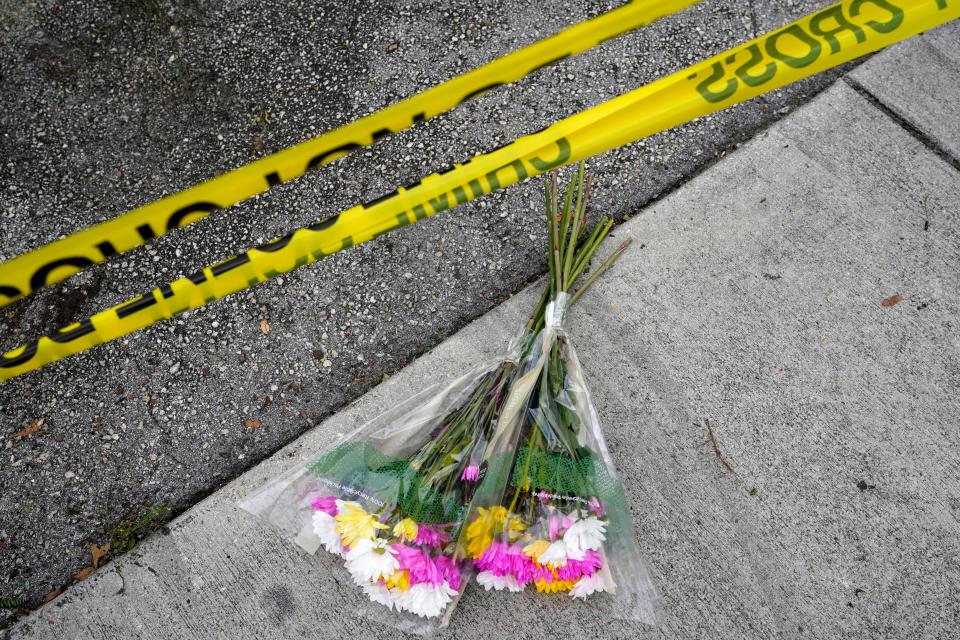 Flowers lie at the scene where a driver slammed into spectators at the start of a Pride parade Saturday evening, killing one man and seriously injuring another, Sunday, June 20, 2021, in Fort Lauderdale, Fla. Officials said the crash was an accident, but it initially drew speculation that it was a hate crime directed at the gay community. The driver and victims were all members of the Fort Lauderdale Gay Men's Chorus, who were participating in the Wilton Manors Stonewall Pride Parade.