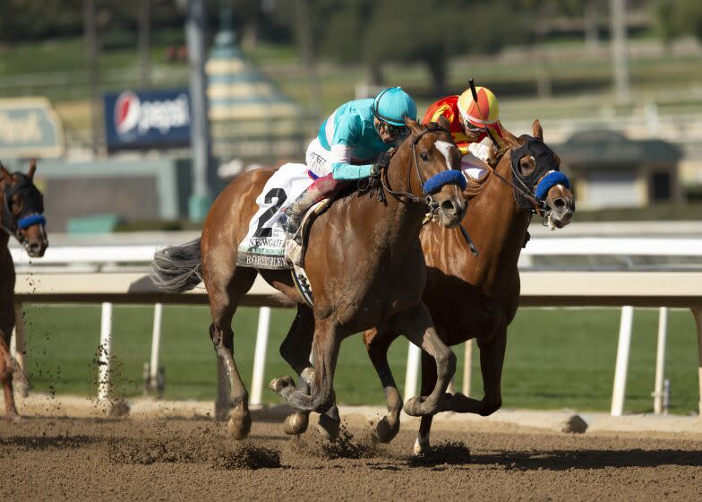 In a photo provided by Benoit Photo, Newgate and jockey Lanfranco Dettori, outside.