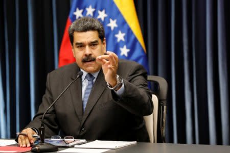 FILE PHOTO: Venezuela's President Nicolas Maduro gestures as he talks to the media during a news conference at Miraflores Palace in Caracas, Venezuela, September 18, 2018. REUTERS/Marco Bello