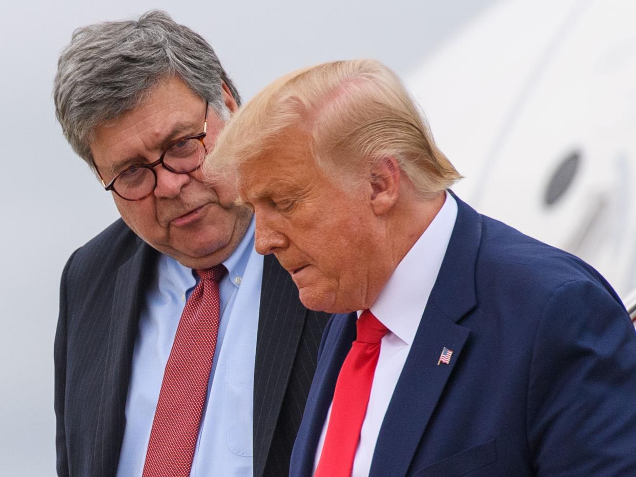 US President Donald Trump (R) and US Attorney General William Barr step off Air Force One upon arrival at Andrews Air Force Base in Maryland on September 1, 2020