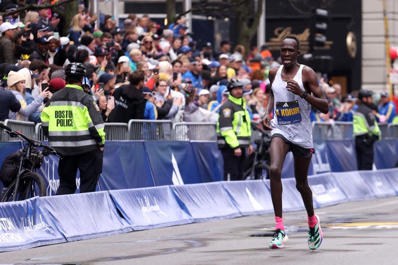 Albert Korir of Kenya crosses the finish line to place fourth in the professional Men’s Division during the 127th Boston Marathon on April 17, 2023 in Boston, Massachusetts.