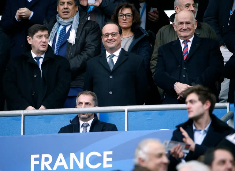 French President Francois Hollande (C), French Minister for Cities, Youth and Sport Patrick Kanner (L) and President of the French Rugby Federation Pierre Camou (R) attend the Six Nations international rugby union match between France and Italy