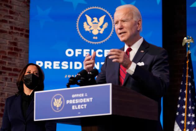 Vice President-elect Kamala Harris listens as President-elect Joe Biden speaks during an event at The Queen theater Friday in Wilmington, Delaware. Biden and Harris are in Washington for Inauguration Day.