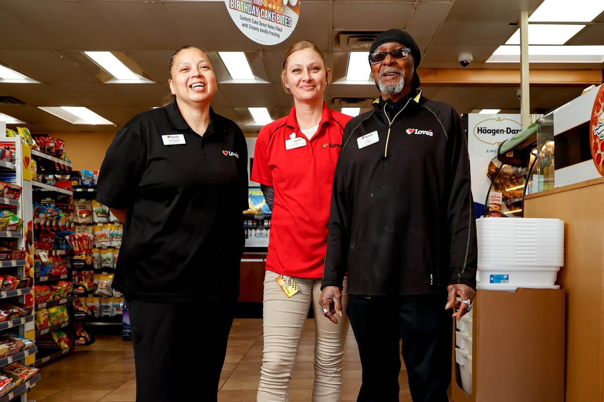 Lisa Doctor, the general manager (left), Sarah Hays, a manager (center) and Al Harper, a 24-year employee are pictured April 12 at the first Love’s location in Watonga.