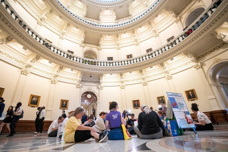 Demonstrators read in the middle of the Capitol Rotunda in April as The Texas Freedom Network holds a "read-in" to protest House Bill 900.