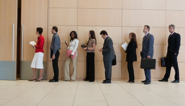 Businesspeople standing in line