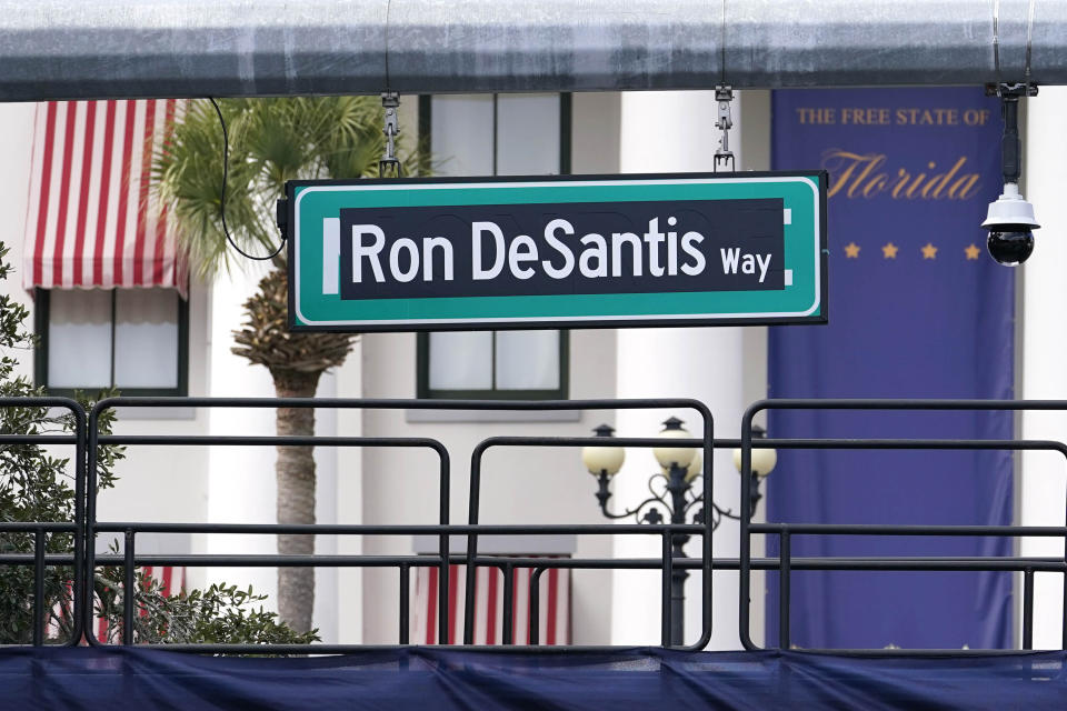 A street sign with the name of Florida Gov. Ron DeSantis hangs in front of the Old Capitol as preparations are underway for the inauguration of the governor, Monday, Jan. 2, 2023, in Tallahassee, Fla. DeSantis will be sworn in for his second term as Florida Governor Tuesday. (AP Photo/Lynne Sladky)