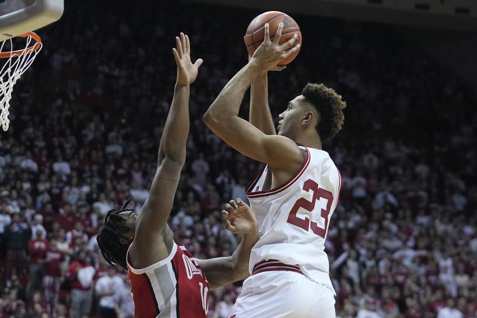 Indiana's Trayce Jackson-Davis (23) shoots over Ohio State's Brice Sensabaugh (10) during the second half of an NCAA college basketball game, Saturday, Jan. 28, 2023, in Bloomington, Ind. (AP Photo/Darron Cummings)