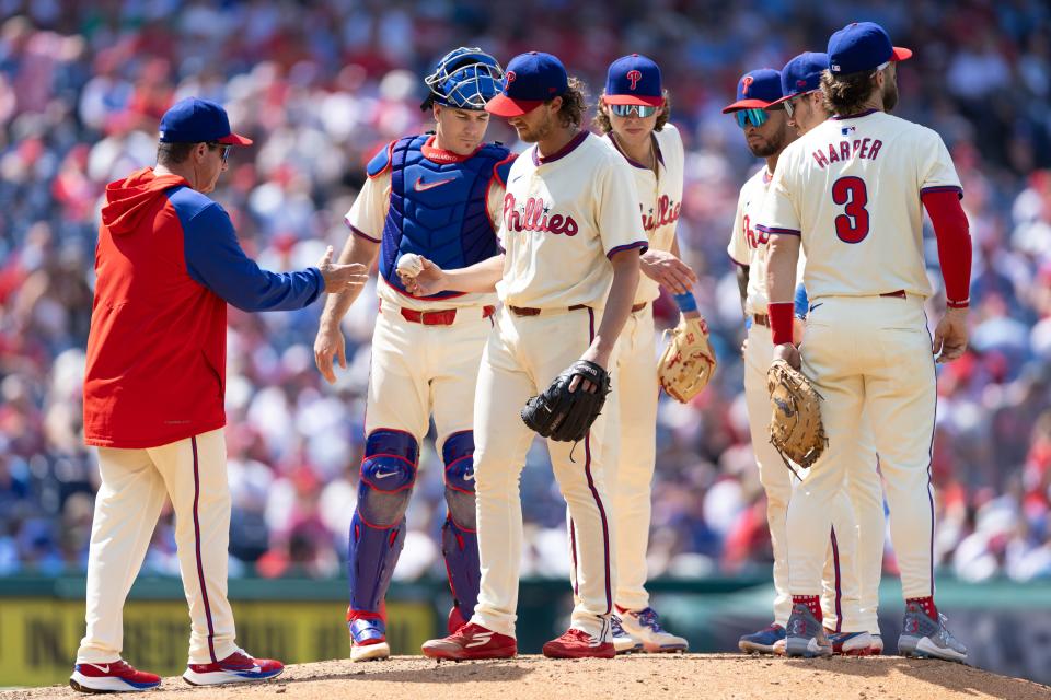 Philadelphia Phillies pitcher Aaron Nola (27) is relieved by manager Rob Thomson during the sixth inning against the Toronto Blue Jays Wednesday, May 8, 2024, at Citizens Bank Park.
