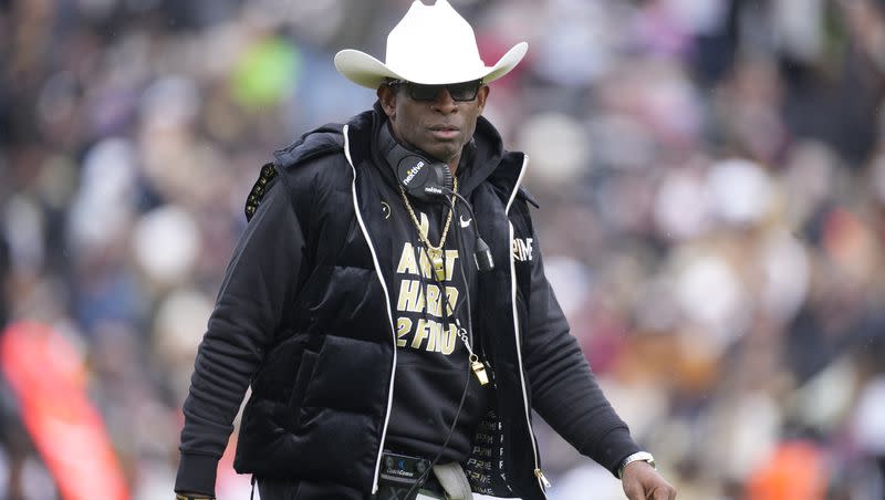 Colorado coach Deion Sanders look on during the Buffaloes spring game Saturday, April 22, 2023, in Boulder, Colo. More than 40 Colorado football players have hit the transfer portal since Sanders was named coach.