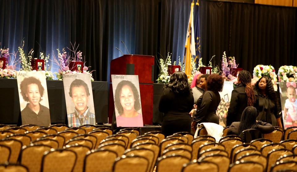 Large photos sit at the front of the hall Monday, Feb. 5, 2024, at a visitation and memorial service at Century Center in South Bend for the six Smith family children killed as a result of the Jan. 21, 2024, fatal house fire on North LaPorte Avenue.