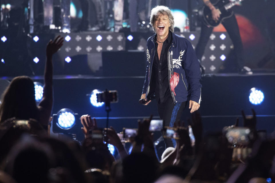 FILE - In this Thursday, July 25, 2019, file photo, singer Jon Bon Jovi performs on a stage during a concert in Tel Aviv, Israel. New Jersey rock royalty was onstage Sunday, Oct. 27, 2019, in the state’s musical cradle as rocker Jon Bon Jovi brought soulful crooner Southside Johnny Lyon with him into the New Jersey Hall of Fame. (AP Photo/Ariel Schalit, File)