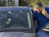 A police officer inspects a car in which a hand-held pager exploded, in Beirut, Lebanon, Tuesday, Sept. 17, 2024. (AP Photo/Hussein Malla)