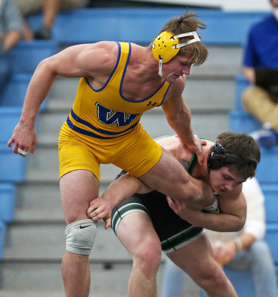 Wooster's Joey Lyons, top, is taken down by Dublin Coffman's Seth Shumate during their 195 pound quarterfinal match in the Division I OHSAA State Wrestling Tournament at Hilliard Darby High School, Saturday, March 13, 2021, in Hilliard, Ohio. [Jeff Lange/Beacon Journal]