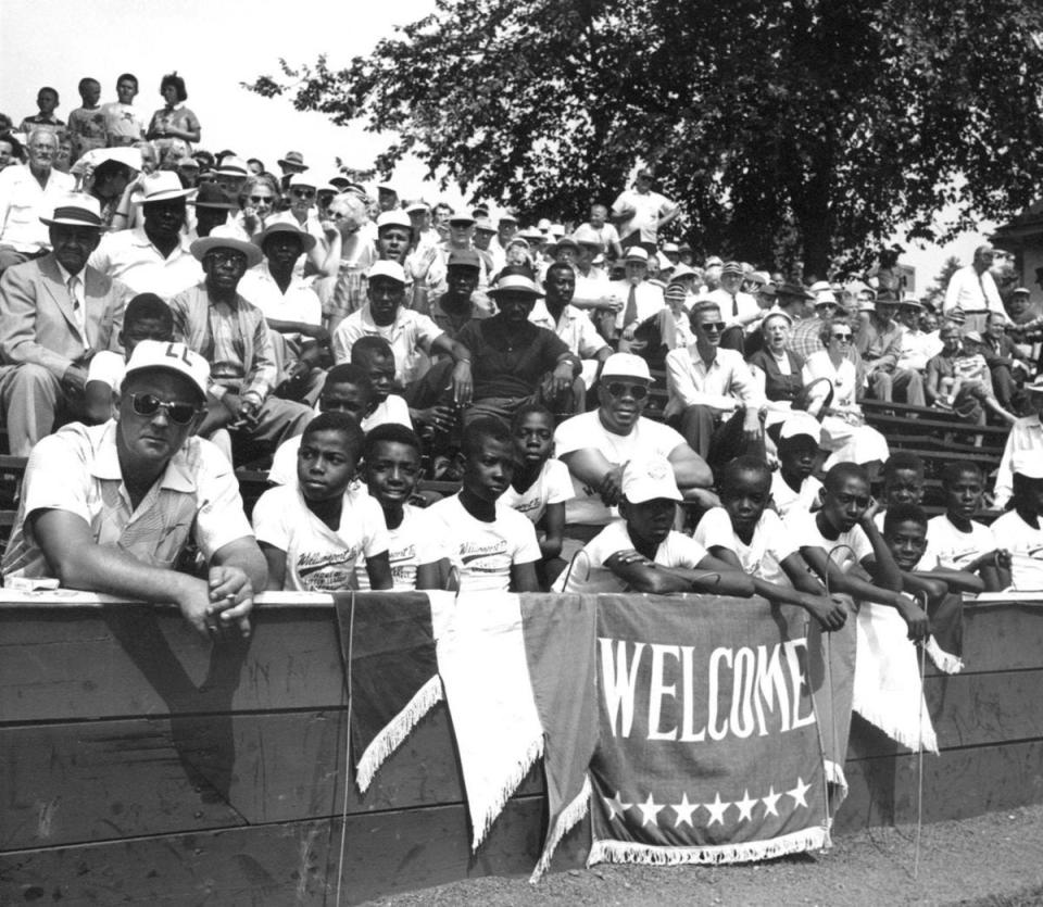 Members of the 1955 Cannon Street YMCA All-Star team sit in the bleachers during the Little League World Series in South Williamsport, Pa. The team was invited to watch the games but not allowed to play.