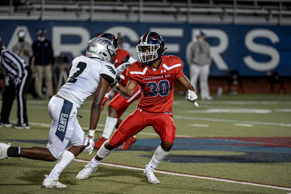 Providence Day sophomore cornerback Chris Peal (30) defends Charlotte Latin senior wide receiver Daniel Haughton (2) during a Oct. 2, 2020, home game. Peal played a key role in the Chargers' NCISAA Division I state semifinal run last fall and enters his junior season with eight Division I offers, including UNC and N.C. State.