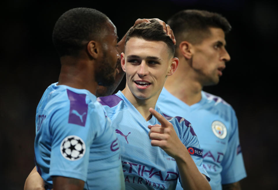 Manchester City's Phil Foden celebrates scoring his side's second goal of the game with Raheem Sterling during the UEFA Champions League match at the Etihad Stadium, Manchester. (Photo by Nick Potts/PA Images via Getty Images)