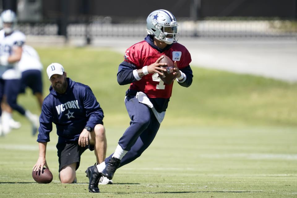 Dallas Cowboys quarterback Dak Prescott (4) participates in practice at the team's NFL football training facility in Frisco, Texas, Thursday, Sept. 23, 2021. (AP Photo/Tony Gutierrez)