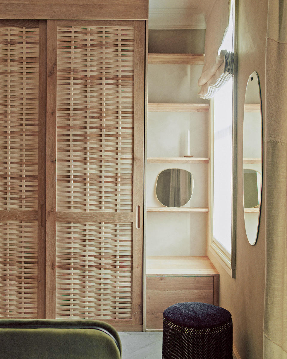 Beige bedroom with light wood wardrobe by Sebastian Cox