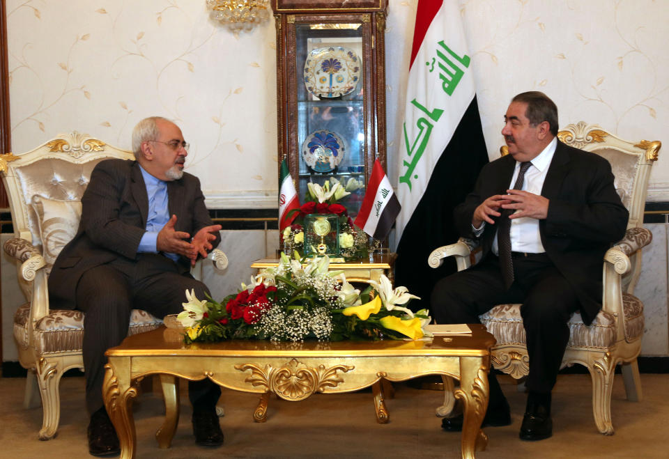 Iraqi Foreign Minister Hoshyar Zebari, right, meets with his Iranian counterpart Mohammad Javed Zarif in Baghdad, Iraq, Tuesday, Jan. 14, 2014. (AP Photo/Khalid Mohammed, Pool)