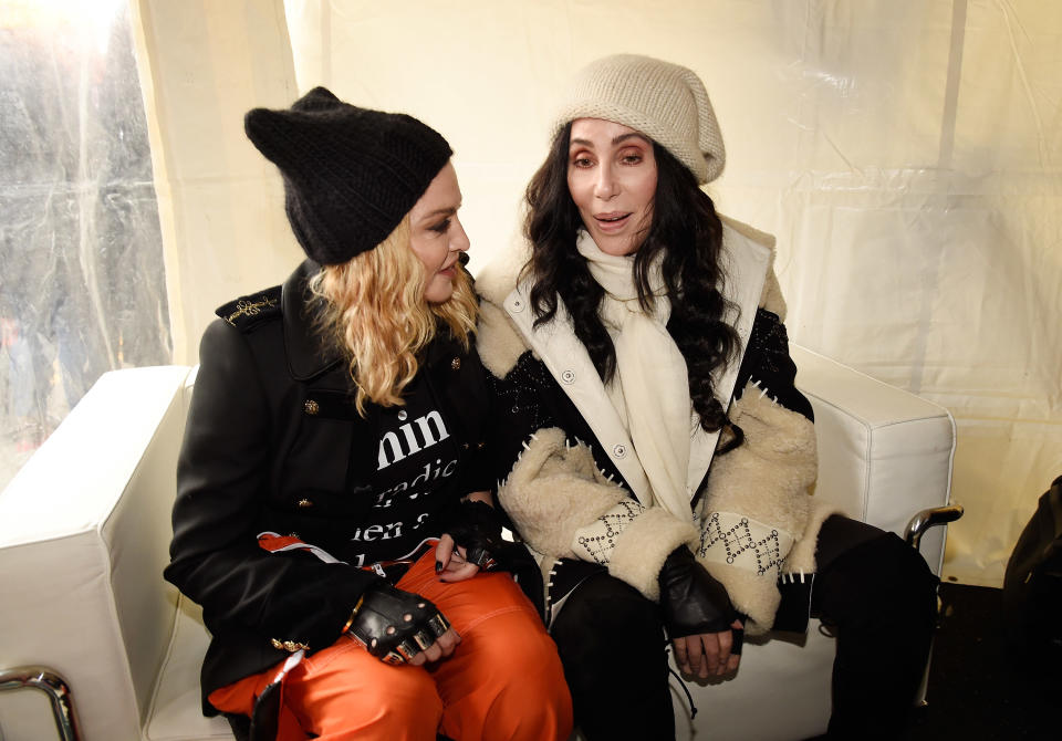 closeup of madonna and cher sitting together