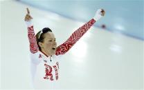 Olga Graf of Russia reacts after her women's 3000 meters speed skating race during the 2014 Sochi Winter Olympics, February 9, 2014. REUTERS/Issei Kato