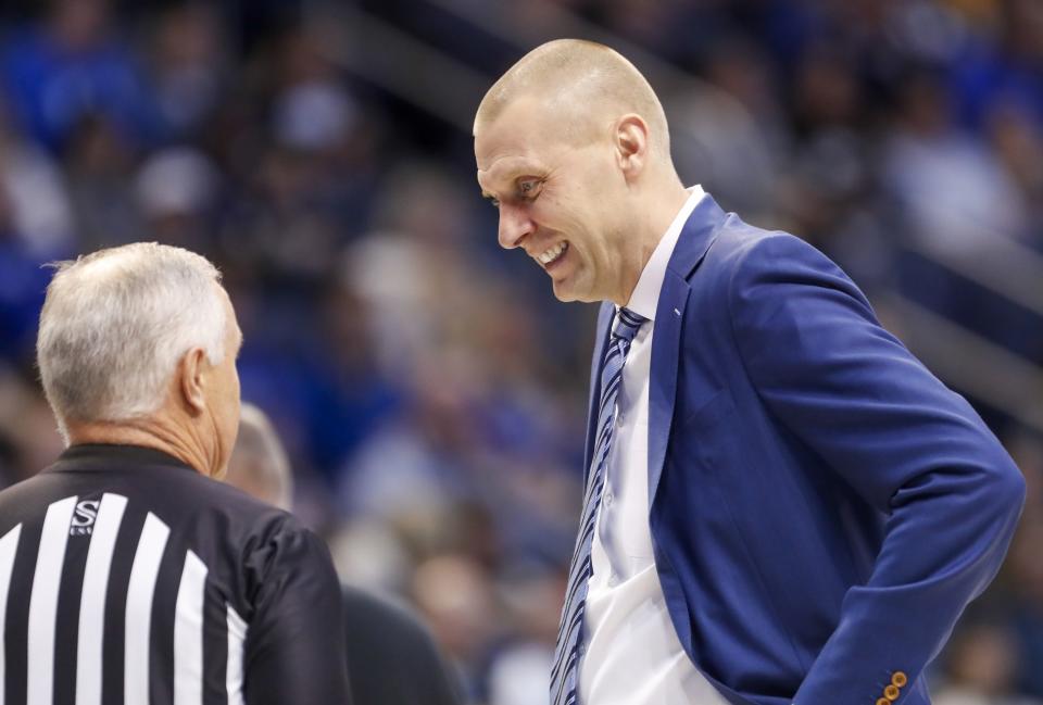 BYU head coach Mark Pope talks to an official during game against Weber State in Provo on Thursday, Dec. 22, 2022. BYU won 63-57.