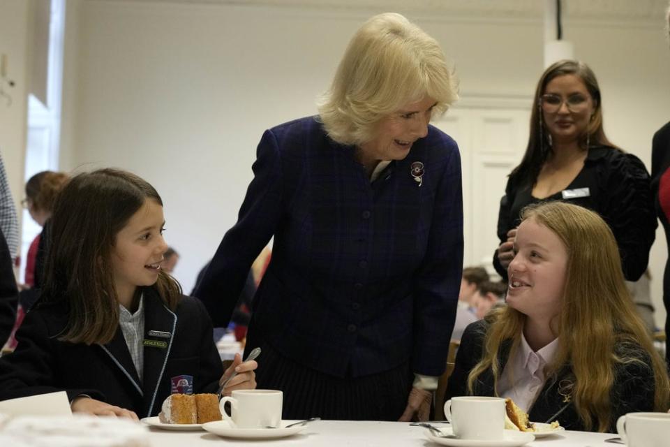 The Duchess of Cornwall talks to schoolchildren during the tea party at the Royal Geographical Society (Frank Augstein/PA) (PA Wire)