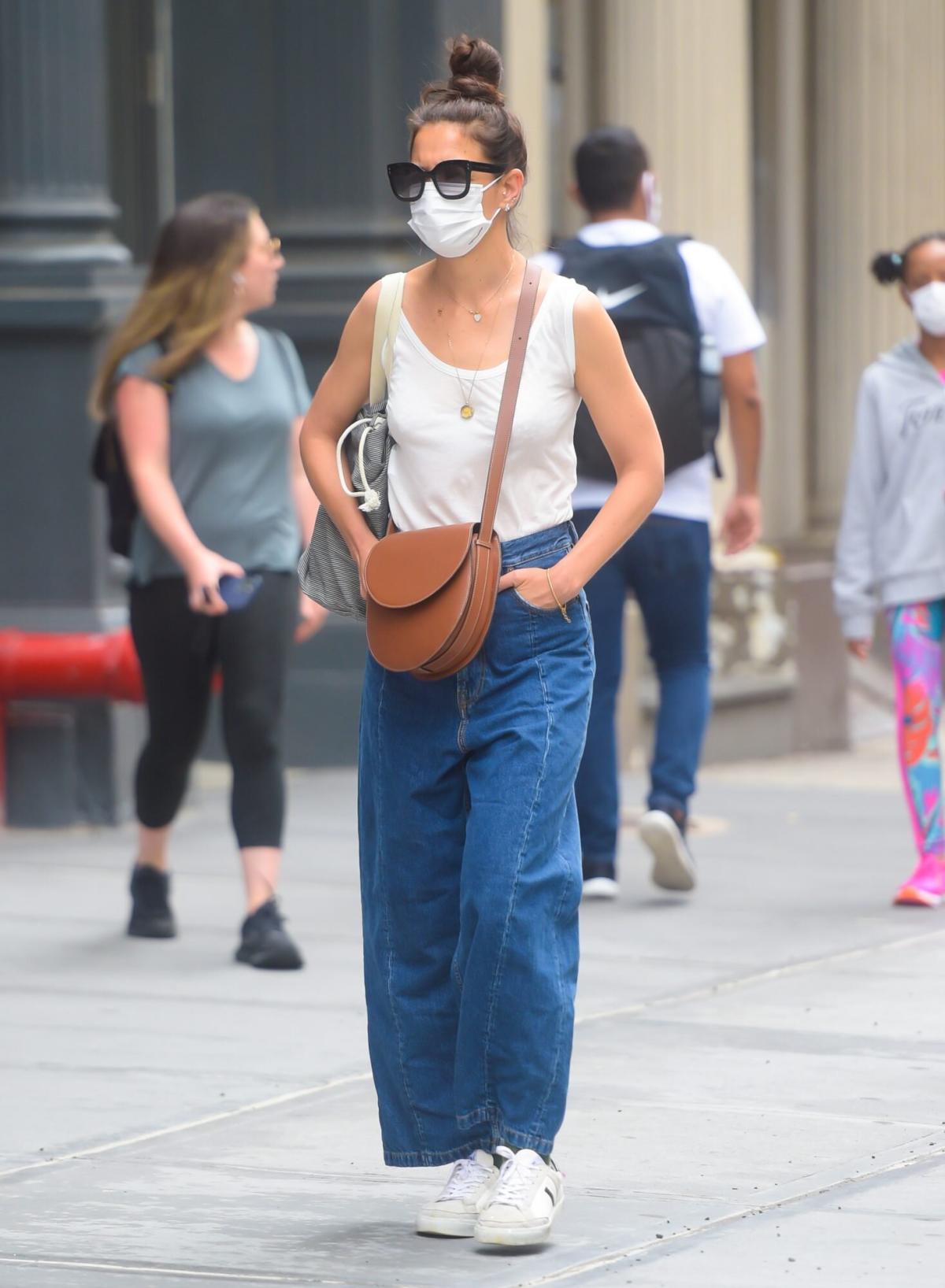 Katie Holmes wearing a zipped front denim dress shopping at