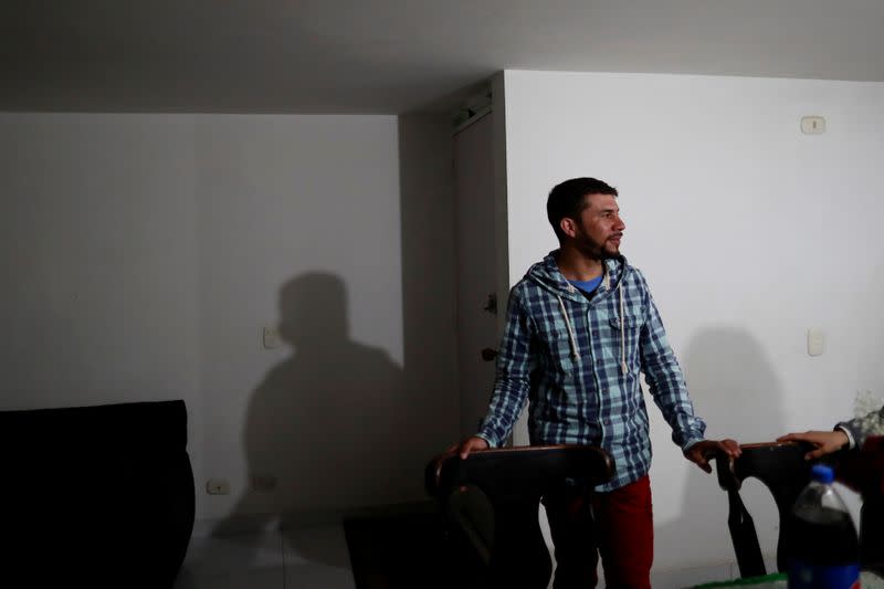 Anthony Vazquez from Venezuela stands in his relatives' house in Bogota