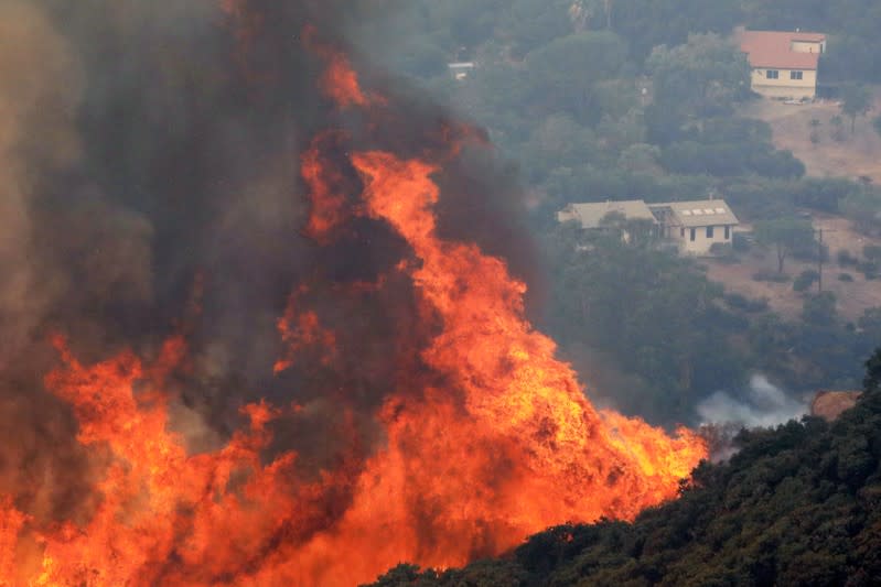 A wildfire dubbed the Cave Fire burns in the hills of Santa Barbara, California