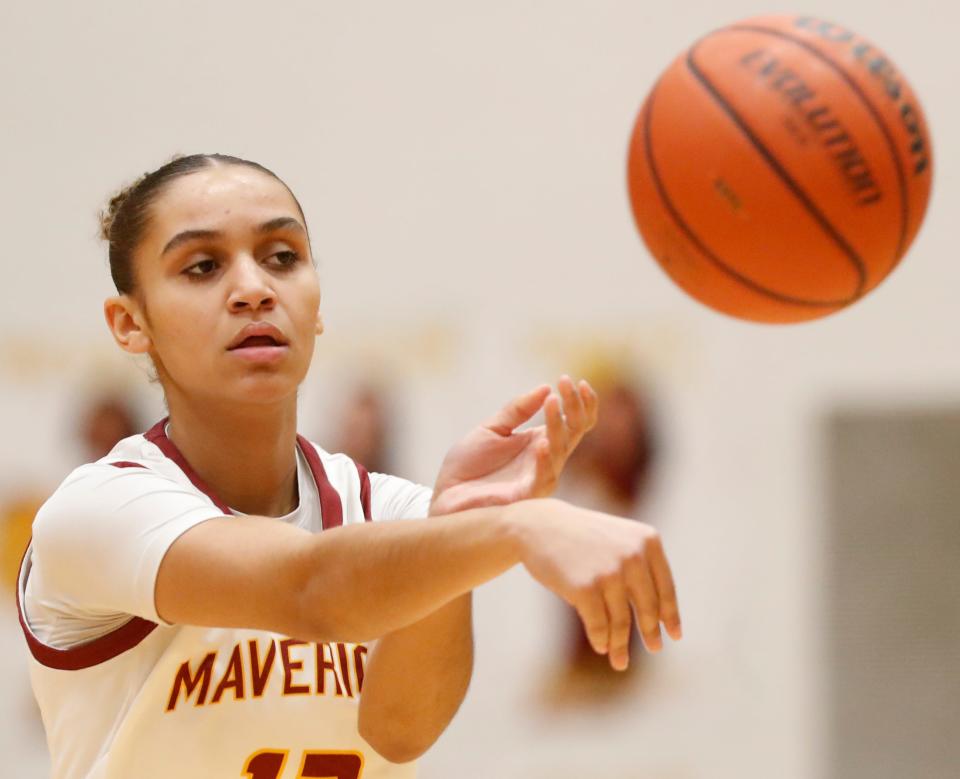 McCutcheon Mavericks Lillie Graves (12) passes the ball during the IHSAA girl’s basketball game against the Richmond Red Devils, Saturday, Jan. 6, 2024, at McCutcheon High School in Lafayette, Ind.