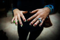 <p>A girl shows off her Palestinian themed nails after a recent bombing campaign. (Photograph by Monique Jaques) </p>