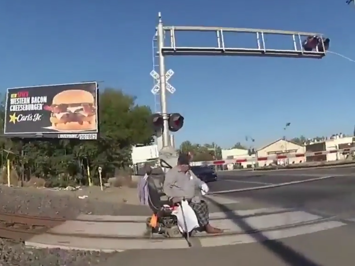 Bodycam footage of officer Erika Urrea running over to the elderly man to pull him off the train tracks: (Lodi Police Department)