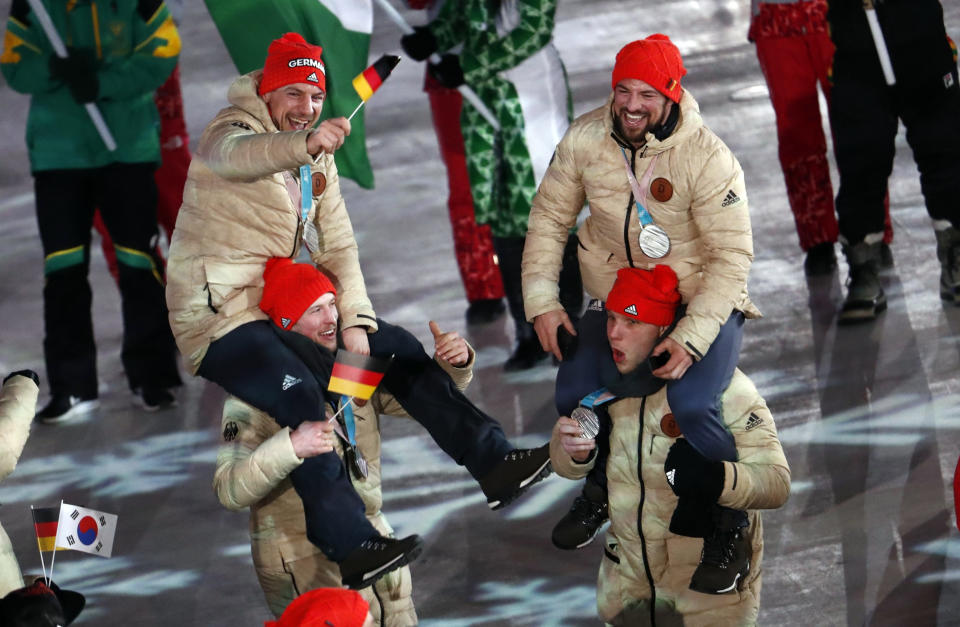 German silver ice hockey players&nbsp;celebrate&nbsp;during the closing ceremony.