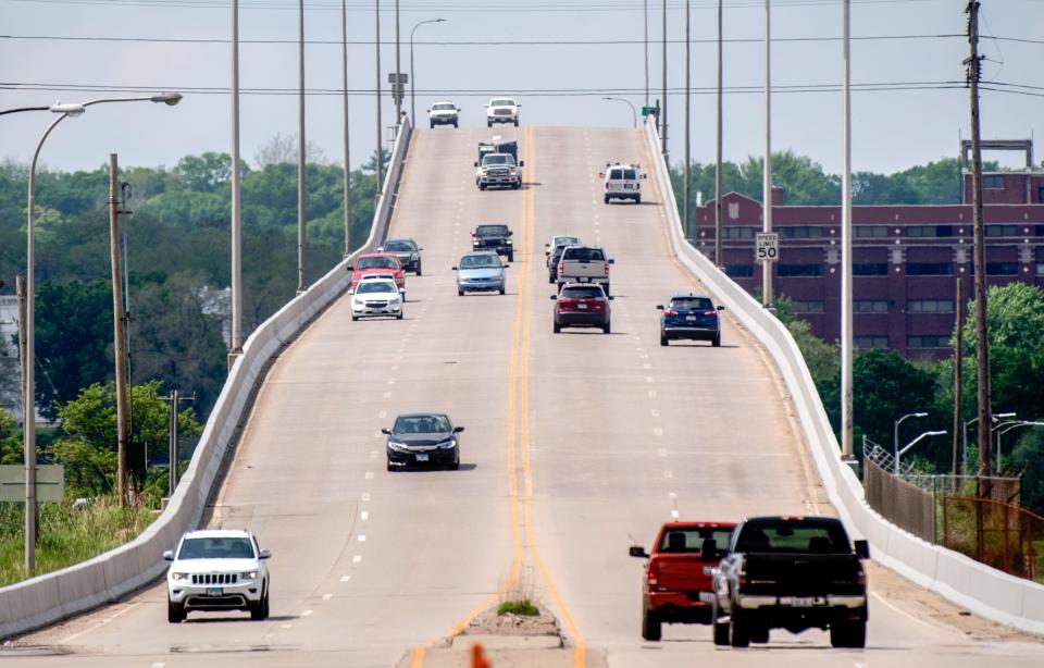 Vehicles cross to and from Tazewell and Peoria County on Wednesday, May 19, 2021 on the Cedar Street Bridge.