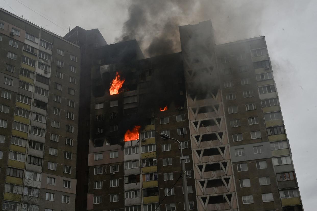 A building burns where at least three people were killed in a "massive" wave of Russian missile and drone attacks across Ukraine early on February 7, 2024.