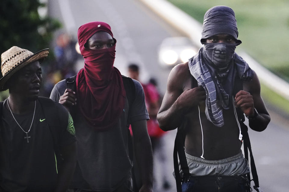 Haitian migrants walk along the highway in Huixtla, Chiapas state, Mexico, early Thursday, Sept. 2, 2021, in their journey north toward the U.S. (AP Photo/Marco Ugarte)