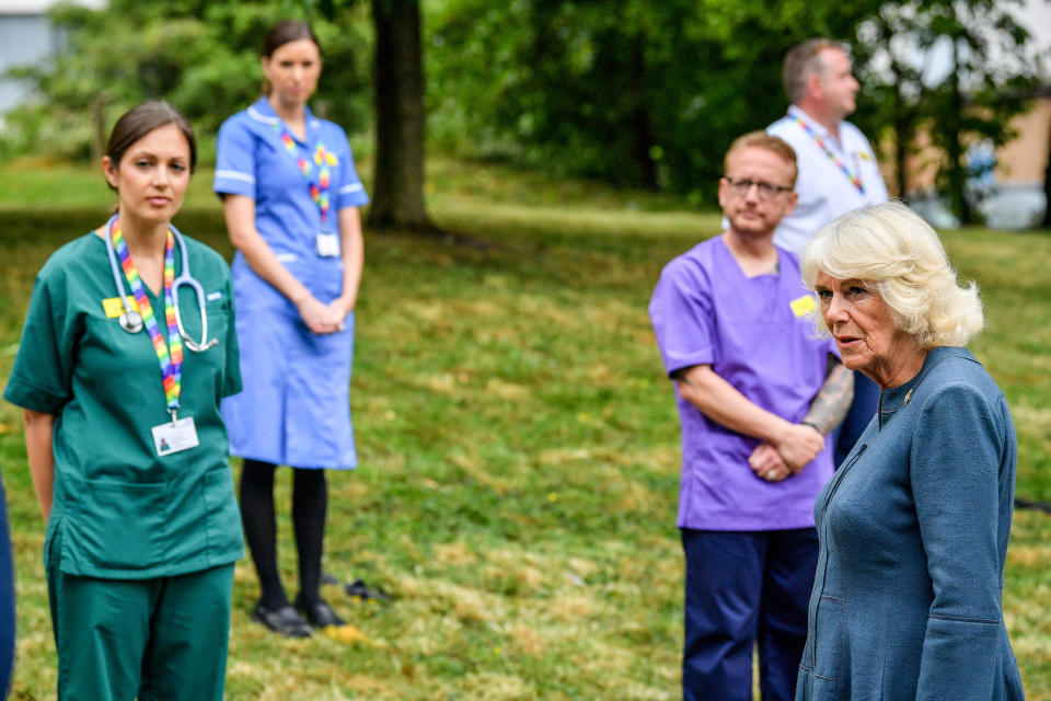 The Duchess of Cornwall chats with NHS staff and front line key workers who who have responded to the COVID-19 pandemic during a visit to Gloucestershire Royal Hospital. (Photo by Ben Birchall/PA Images via Getty Images)