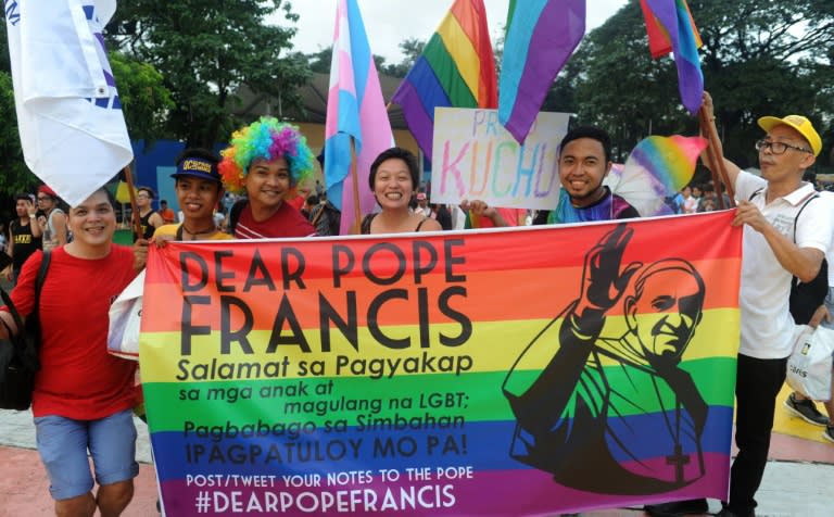 Members and supporters of the lesbian, gay, bisexual, transgender (LGBT) community take part in a parade in Manila on December 13, 2014