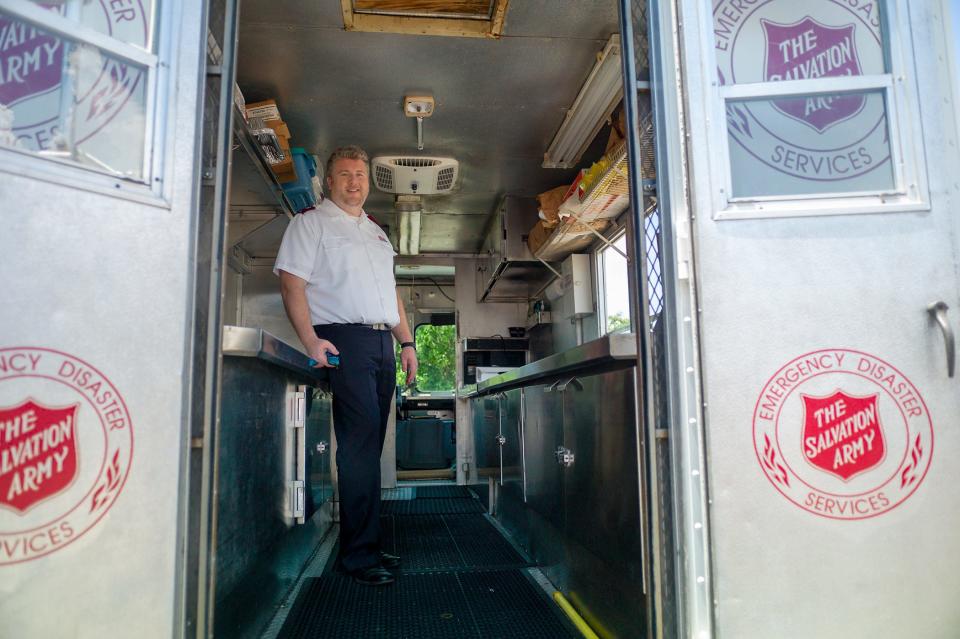 Salvation Army Lieutenant James Milner stands inside the organization's aging canteen truck  in this Daily News file photo. The Salvation Army was recently award a $100,000 grant to replace the 30-year-old vehicle.