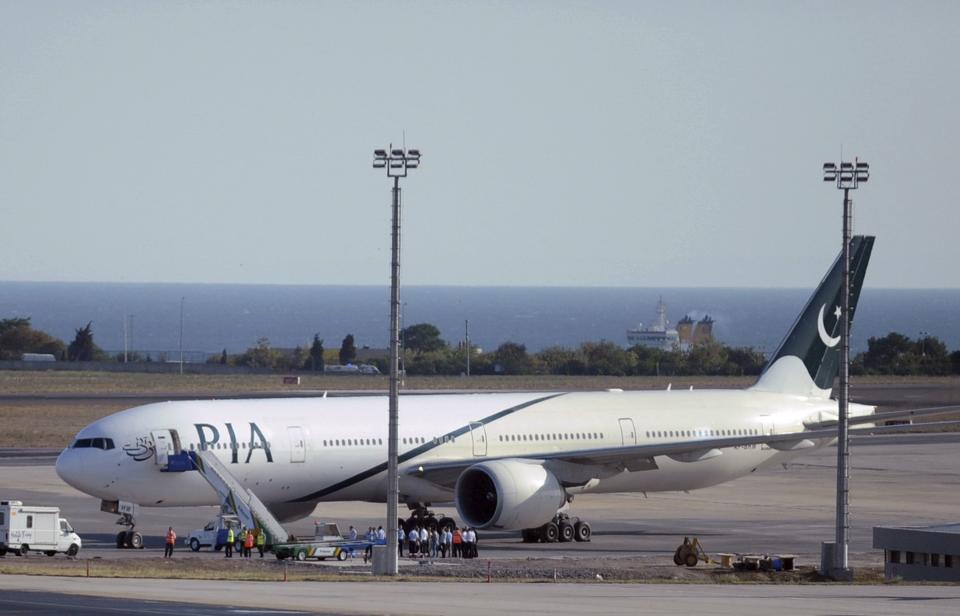 FILE - In this Sept. 7, 2010 file photo, a Pakistan International Airlines plane sits on the tarmac at Ataturk Airport in Istanbul, Turkey. Pakistan’s state-run airline announced Thursday, June 25, 2020, it will ground 150 pilots on charges they obtained their pilot licenses by having others take exams for them. Abdullah Hafeez, a spokesman for PIA, said the decision comes after a probe into last month’s Pakistan International Airlines crash that killed 97 people in the city of Karachi. (AP Photo/File)