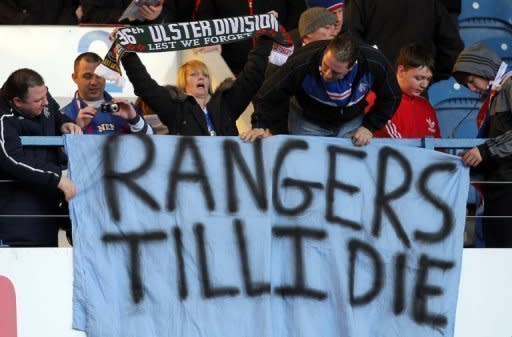 Rangers' fans show their support for the club during the Scottish Premier League match between Rangers and Kilmarnock at Ibrox Stadium in Glasgow in February 2012. Rangers will play in the Third Division next season following a vote of Scottish Football League (SFL) clubs on Friday in a move that could have enormous consequences for the entire future of Scottish football