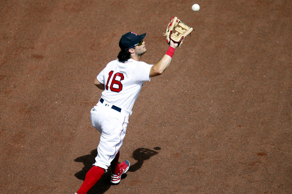 Boston Red Sox's Andrew Benintendi catches a flyout by Baltimore Orioles' Pedro Severino during the sixth inning of a baseball game Saturday, July 25, 2020, in Boston. (AP Photo/Michael Dwyer)