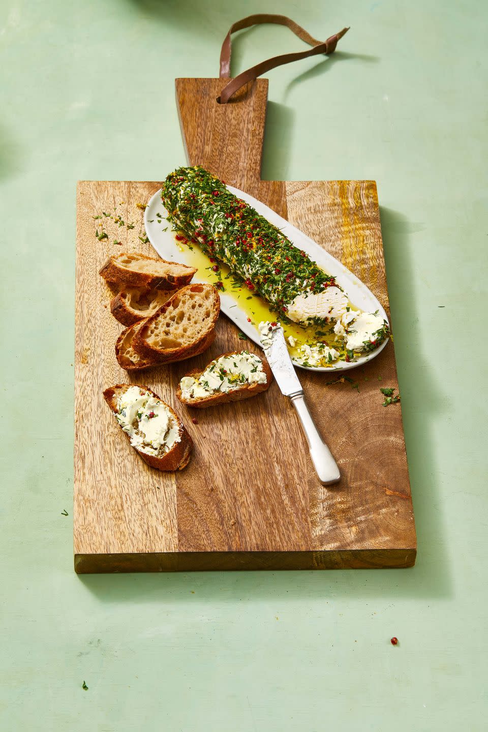 <p>This lemon-herb goat cheese log will keep your guests coming back for more.</p><p>Get the <a href="https://www.goodhousekeeping.com/food-recipes/easy/a30655780/goat-cheese-appetizer-recipe/" rel="nofollow noopener" target="_blank" data-ylk="slk:Goat Cheese Appetizer;elm:context_link;itc:0;sec:content-canvas" class="link "><strong>Goat Cheese Appetizer</strong></a>.</p>